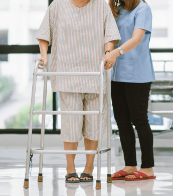 an assistant or caregiver helps the patient to lift the walker, in case it is too heavy for the person trying to walk