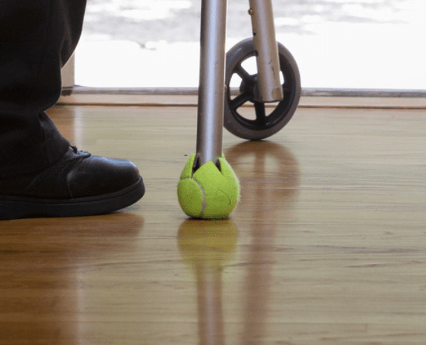 the use of tennis balls under the two rear tips of the walker to help walking